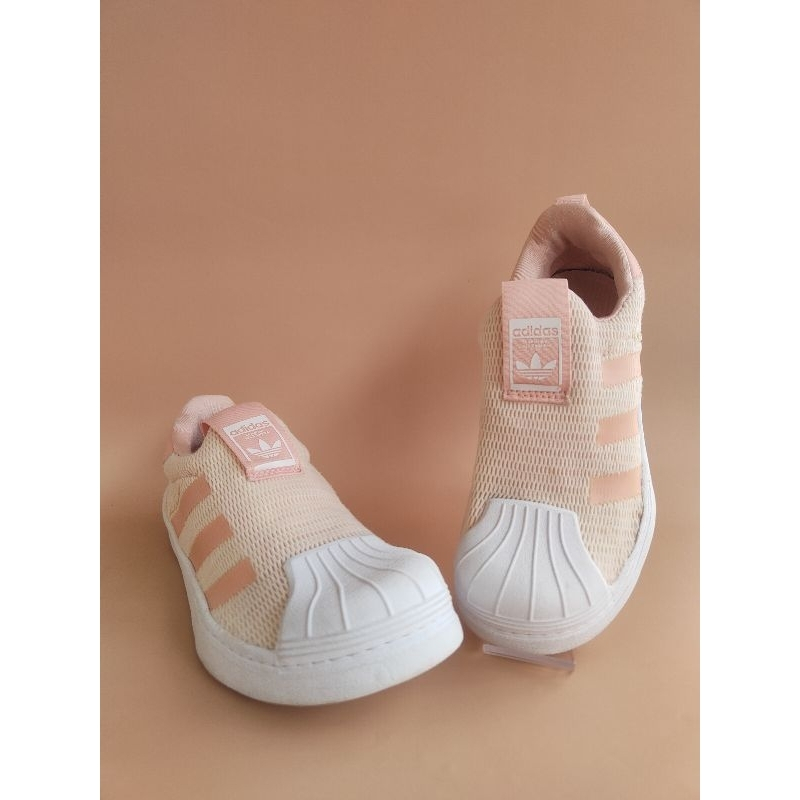 Adidas slip on peach hotsell