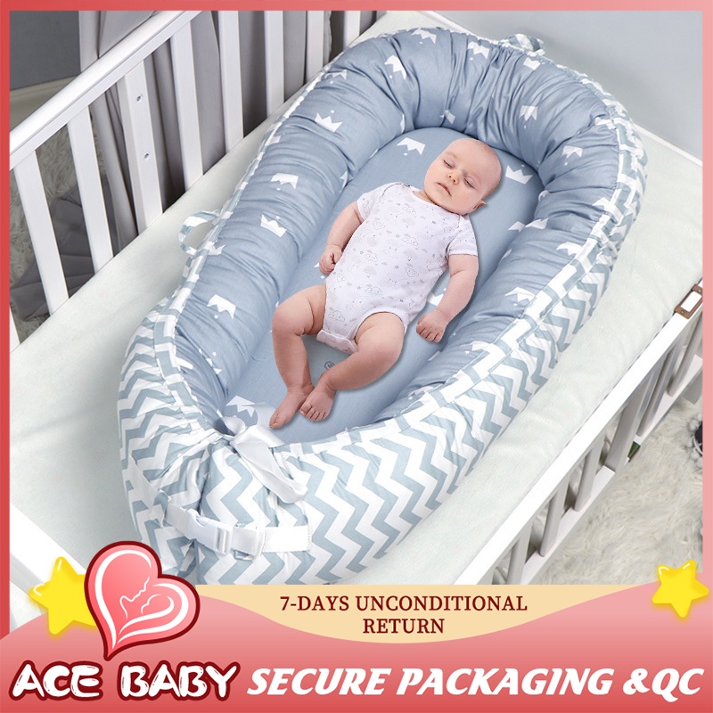 Baby sleeping in travel hot sale cot