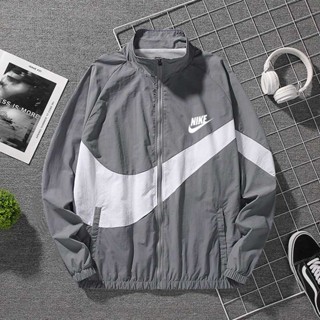 Nike Swoosh Woven jacket in black and cream