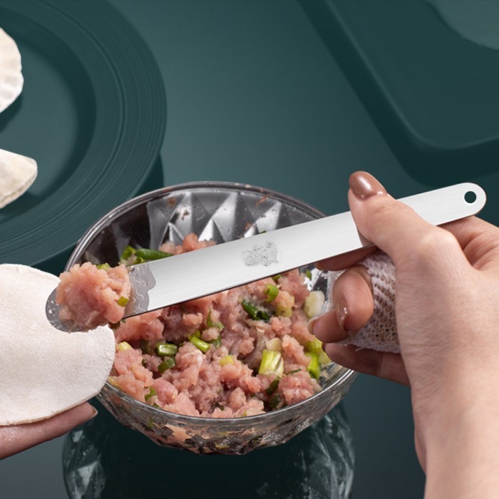 Stainless steel spoon Spatula filled with dimsum dumplings haku ...