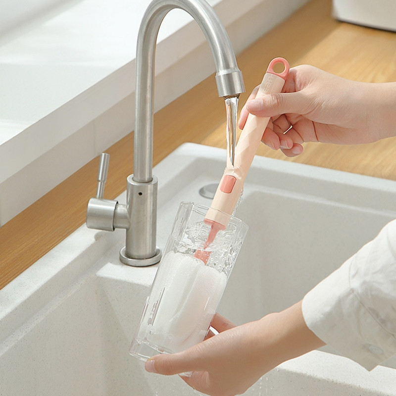 Scrubbing milk bottles, glasses, cups with super clean foam