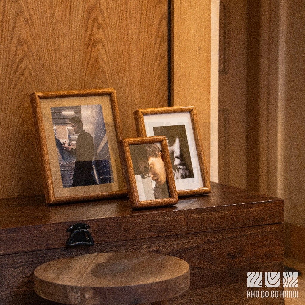Natural wood wall-mounted tabletop photo frames of various sizes and ...