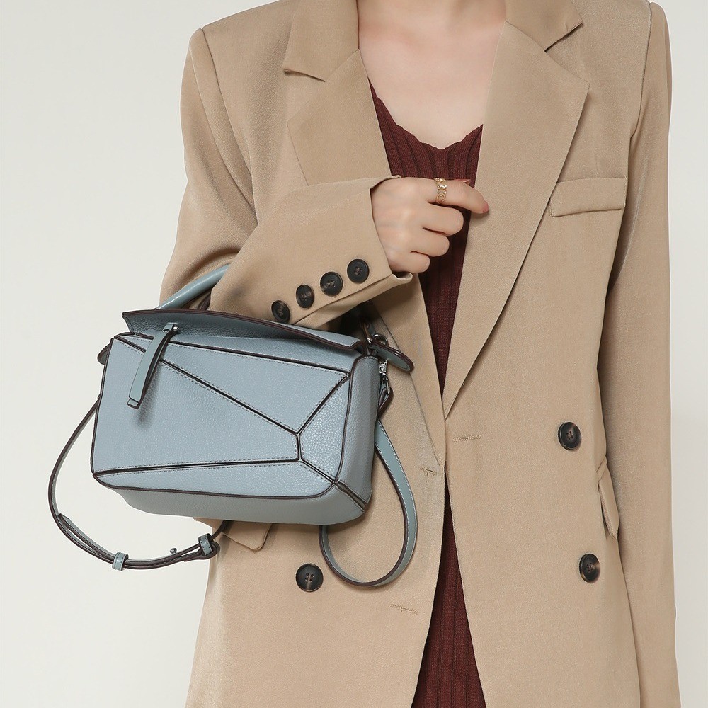 Minimally designed hand-held geometric bag for autumn and winter ...