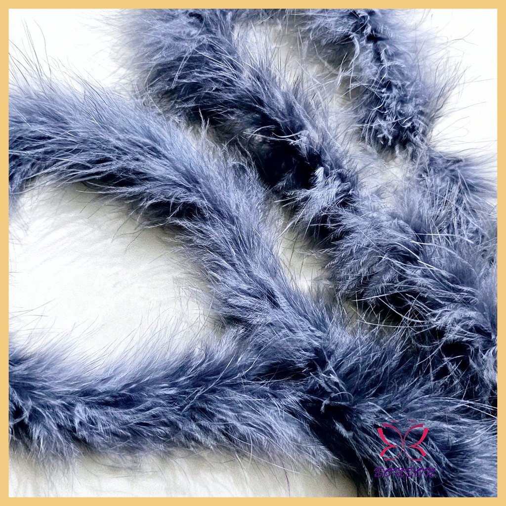 Dark blue fluffy string accessories used to attach costumes and ...