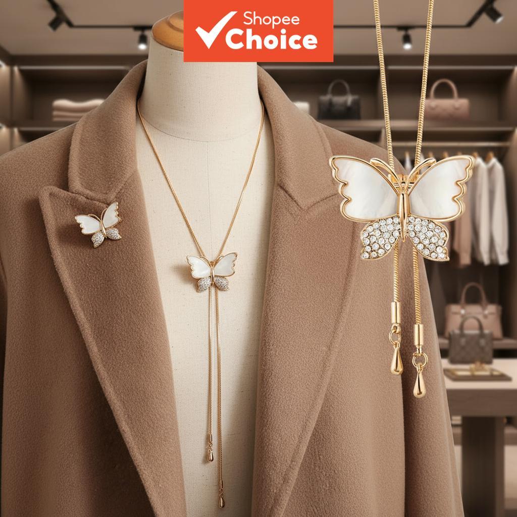 A two-way drape necklace featuring an adjustable chain, adorned with a ...