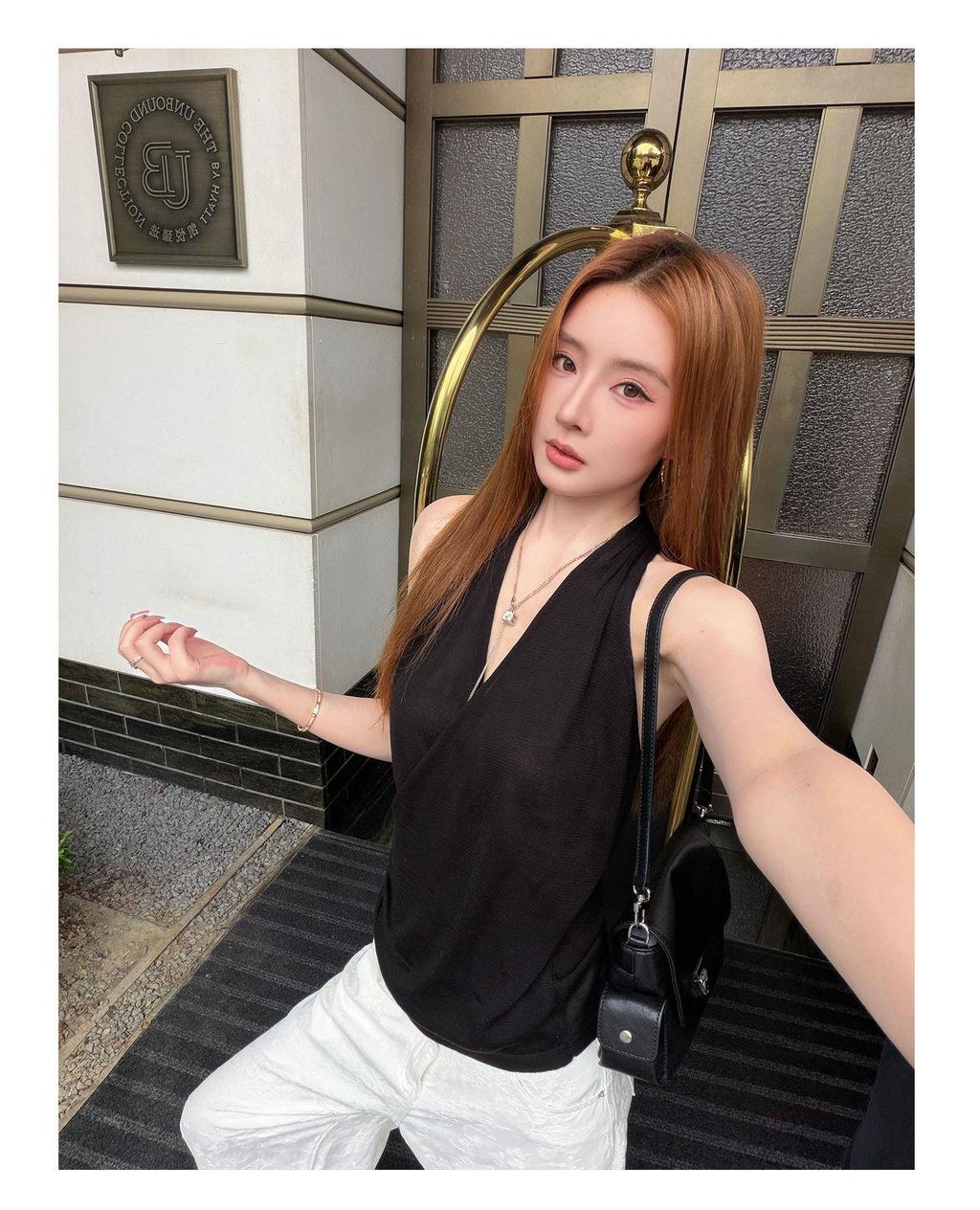 2779#This Korean-style knitted halter top features a V-neck, a sexy yet ...