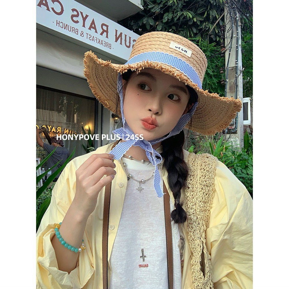 Straw straw hat with tassel border from soft blue striped strap - New ...