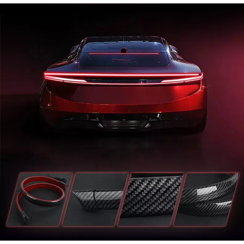 Carbon-textured led light strip mounted on trunk, integrated spoiler ...