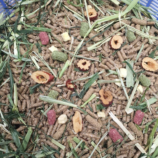 Food mixed with herbs, freeze-dried grass, red apples for rabbits ...