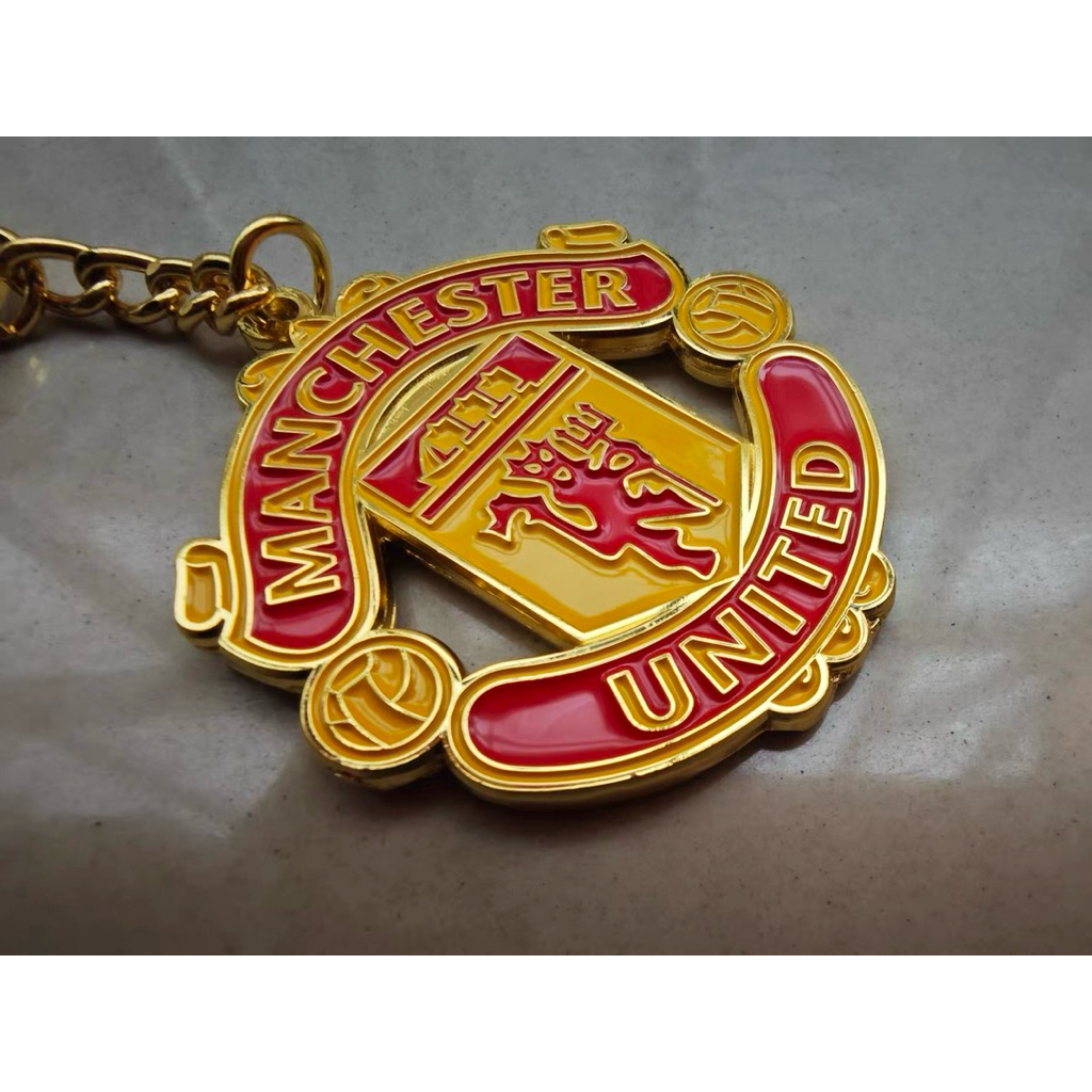 Manchester United ManUtd half-red club keychain as a Old Trafford field ...
