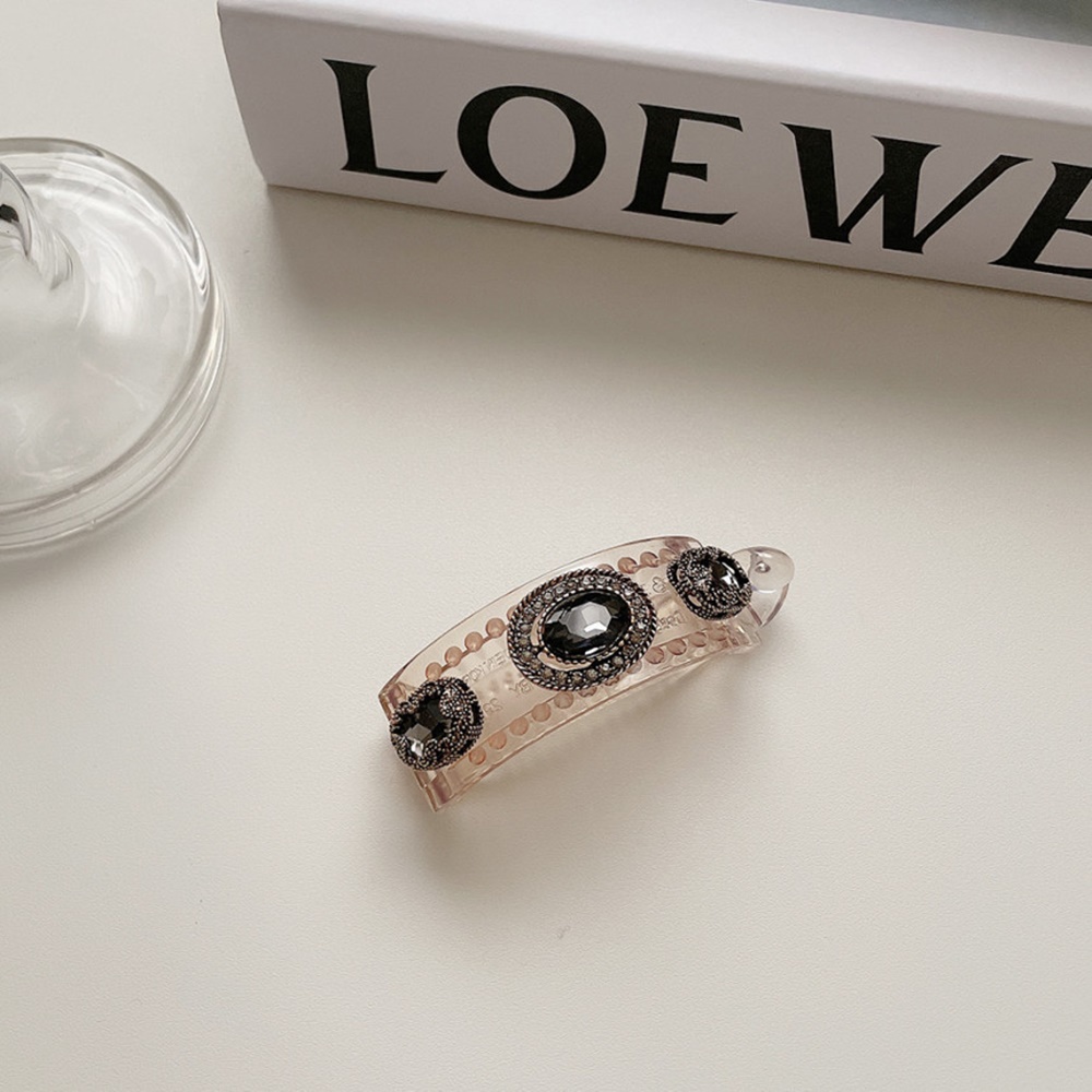 Vertical clip with mysterious black beaded charm, elegant and feminine ...