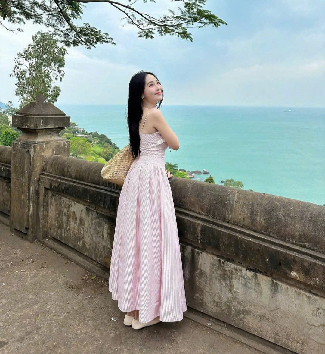 Women's dress designed with 2 straps made of striped poly material with ...