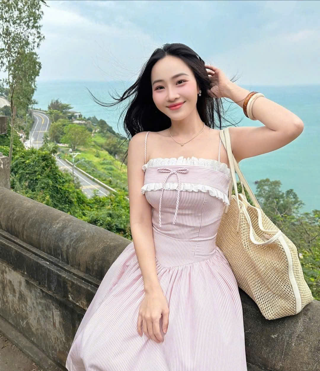 Women's dress designed with 2 straps made of striped poly material with ...