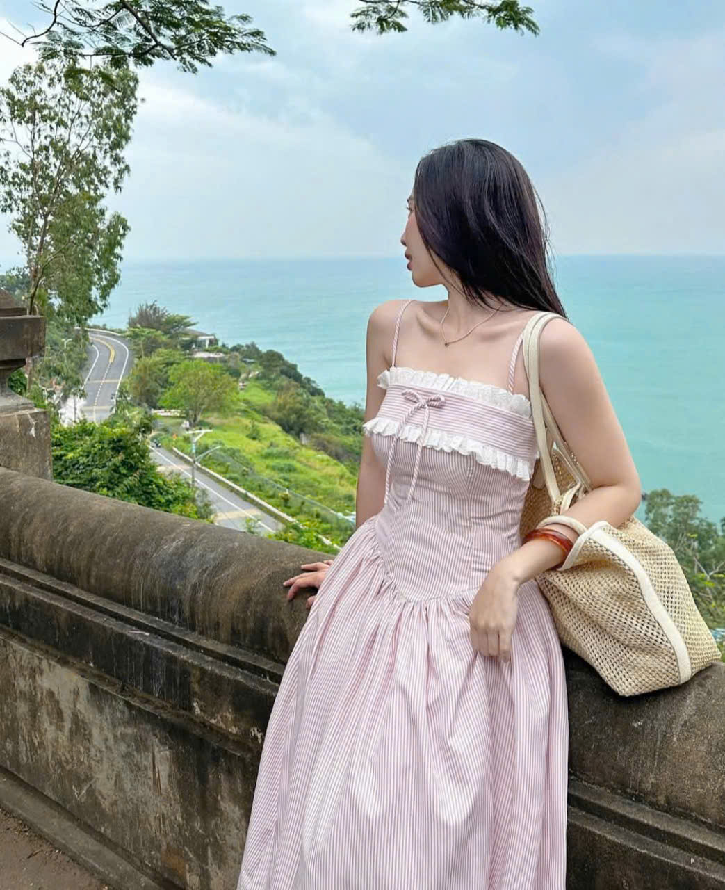 Women's dress designed with 2 straps made of striped poly material with ...